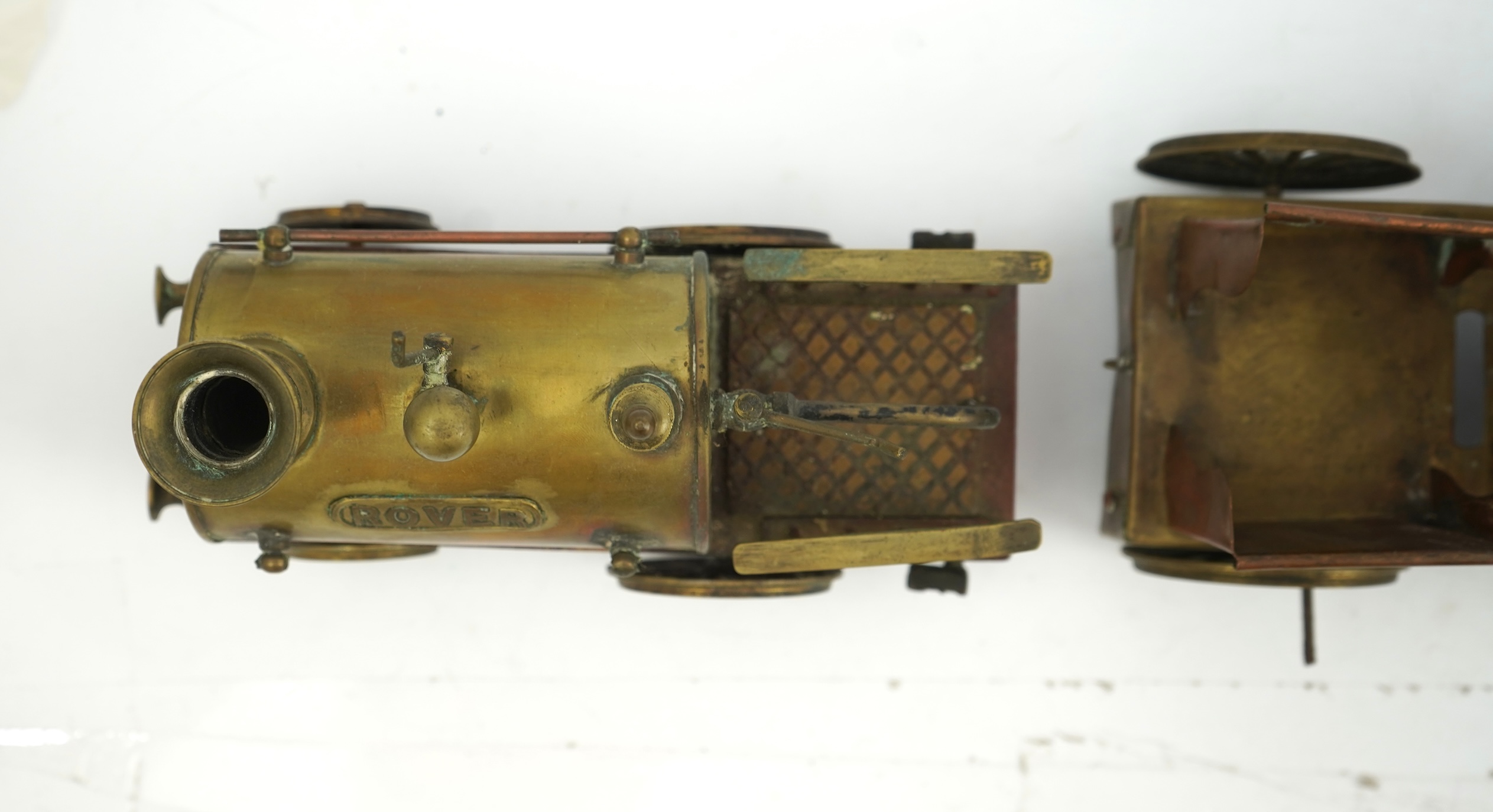 Three late 19th or early 20th century brass and copper live steam locomotives; a 2-2-4, ‘Monarch’, gauged to run on approximately 4 1/2 inch track, 33cm long frames, a 2-2-2, ‘Dragon’, gauged to run on approximately 3 1/